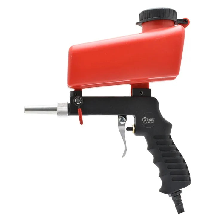 Portable black gravity-feed pneumatic sandblasting gun with a sand tank and trigger.