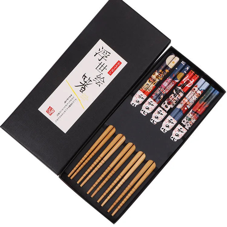 Set of five pairs of bamboo chopsticks with Japanese lucky cat and elegant blue patterns in gift box.