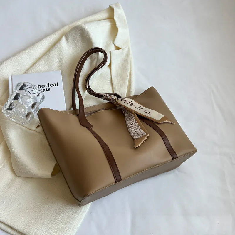 Large capacity bucket tote bag with soft construction and sandwich pocket design