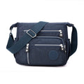 Soft nylon messenger bag with single shoulder strap in square vertical design showing grey colour option