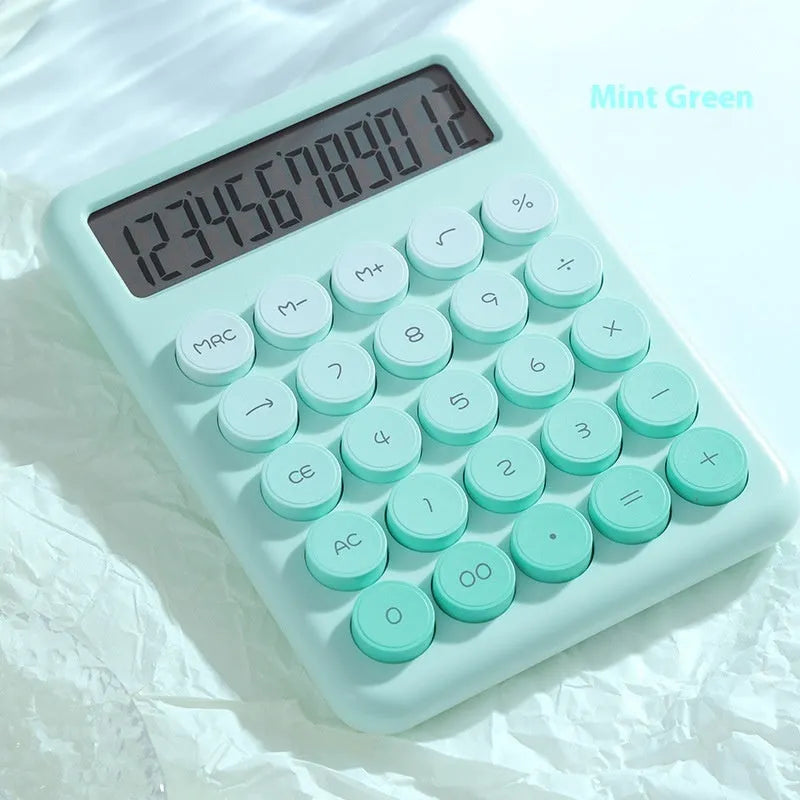 Dopamine gradient colour desk calculator in violet, pink, blue, and green options on a desk