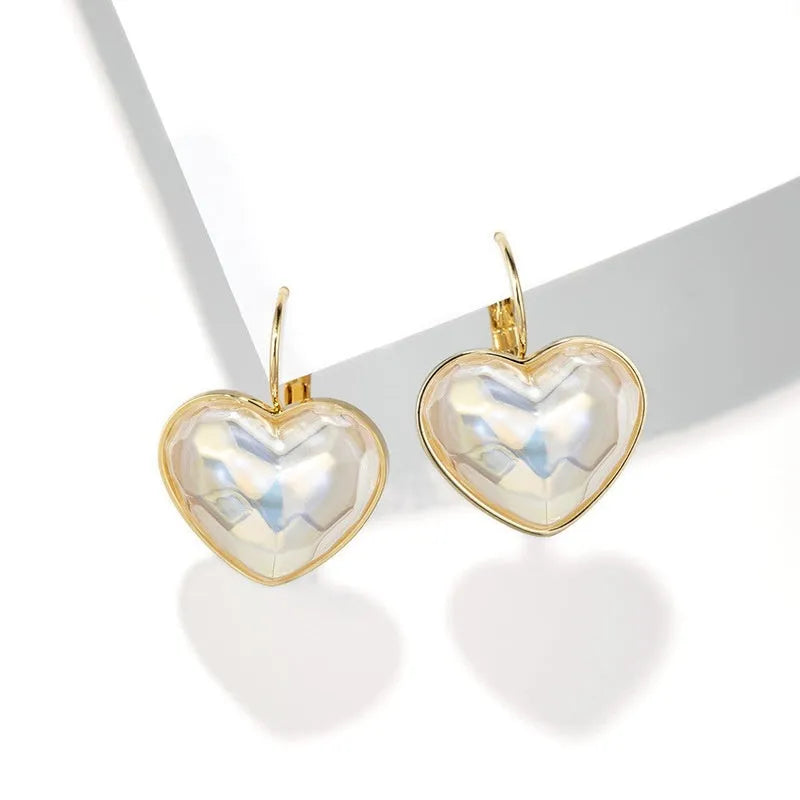 Gold-coloured clip-on earrings with natural style design for women