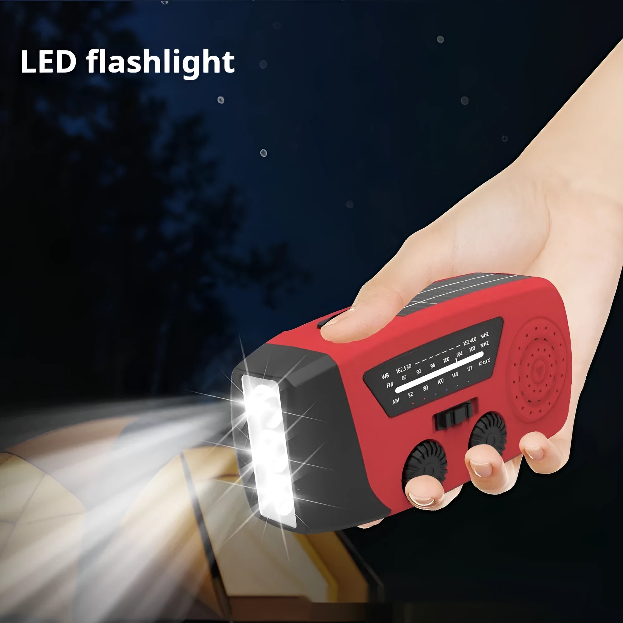 Red rechargeable hand torch radio with wrist strap, showing USB charging port and compact size.