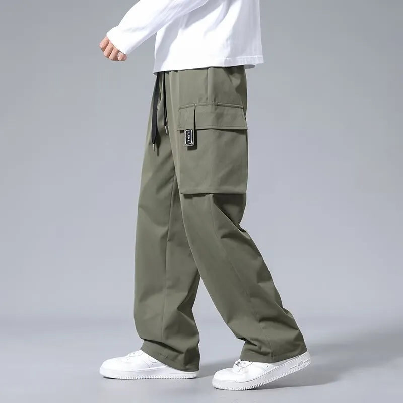 Boys straight leg cargo pants in Army Green with large pockets and a drawstring waist