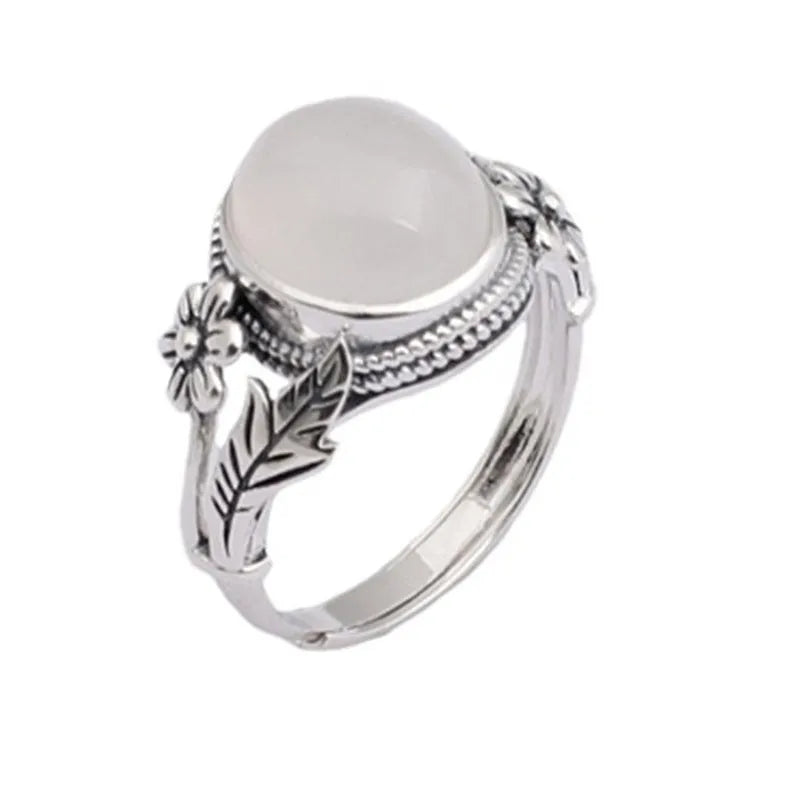 Adjustable vintage-style copper ring with white chalcedony finish showing open mouth design