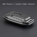 Plastic protective shell for a car key remote, shown in two colour variations