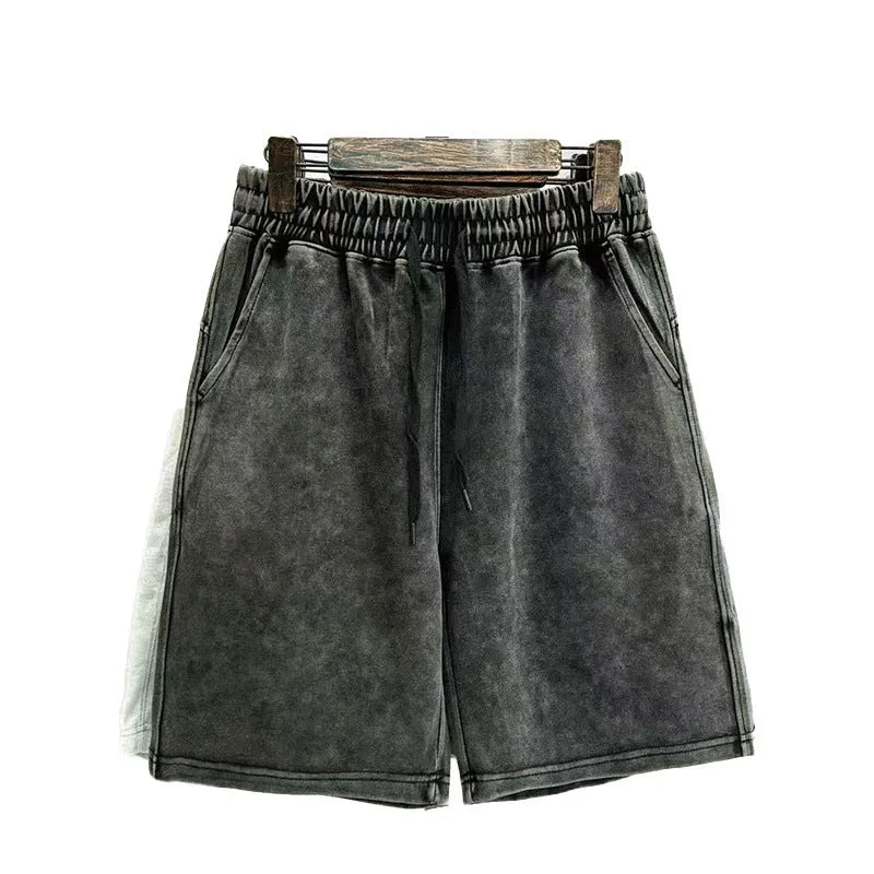 Men's cotton shorts with distressed detailing in straight-leg loose fit