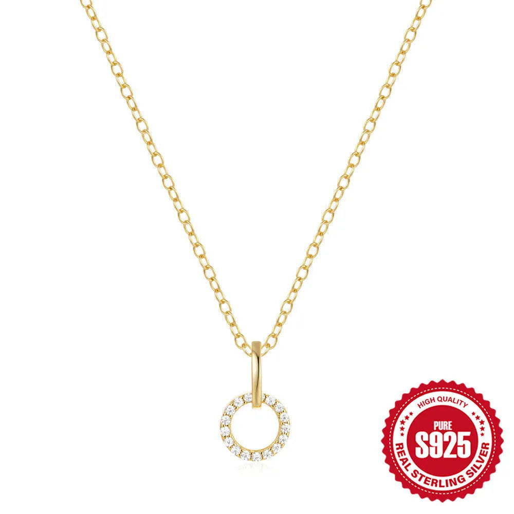Gold coloured S925 sterling silver adjustable clavicle chain with a geometric round zircon pendant.