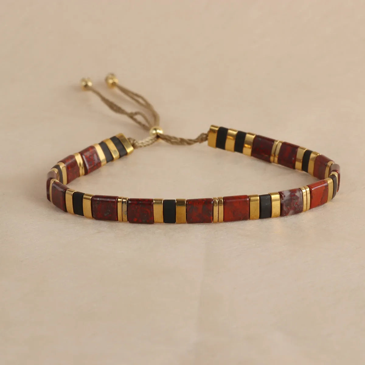 Geometric glass and coloured glaze bead bracelet in milky white, black, green, blue, or red