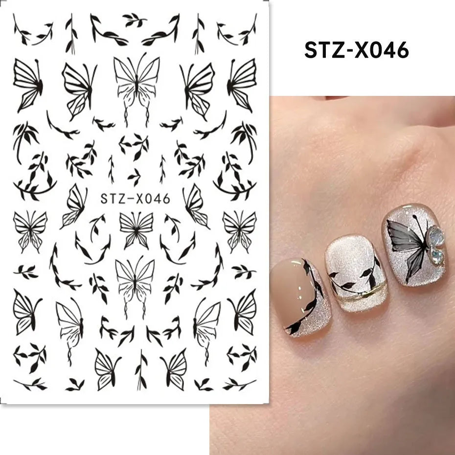 Sheet of black and silver love heart pattern nail art stickers with a plastic nail patch.