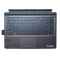 Wireless tablet keyboard on a desk next to an Elite X2 tablet, showing multimedia keys.