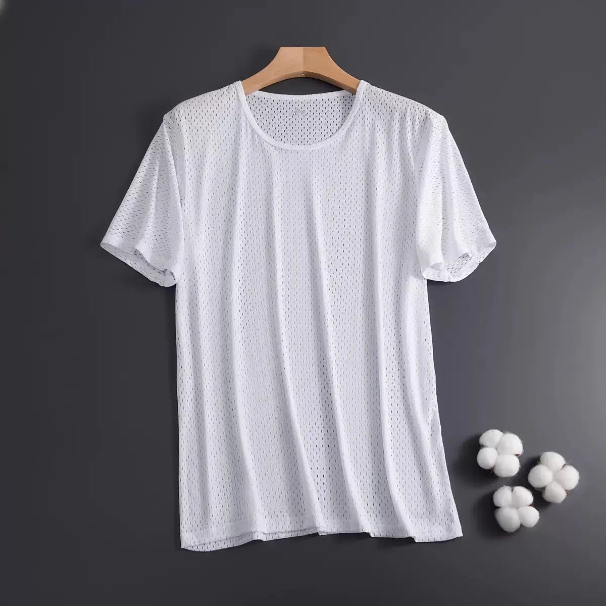 Man wearing a thin grey ice silk mesh short sleeve T-shirt with a crew neck.