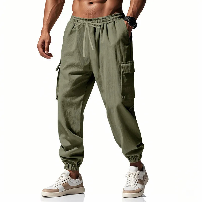 Men's solid colour linen casual trousers with ankle-tied cuffs, multiple pockets, and a drawstring waist