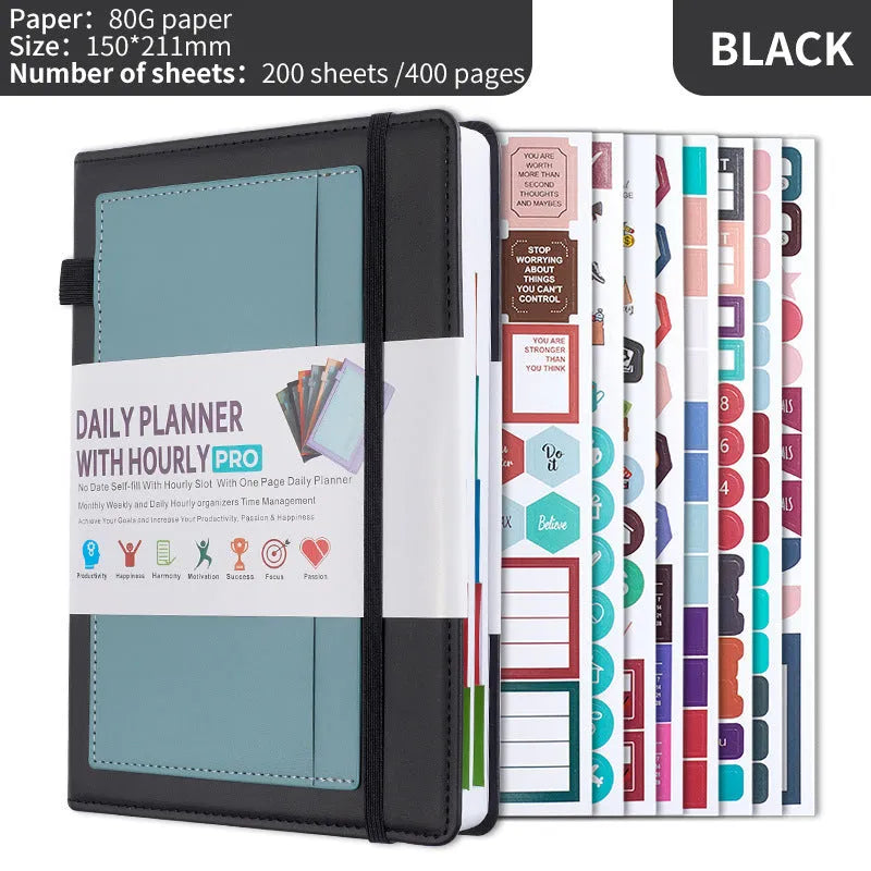 A5 notebook with purple PU cover closed by a black elastic strap