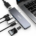 Aluminium USB-C adapter with SD card reader showing multiple ports including HDMI and USB 3.0