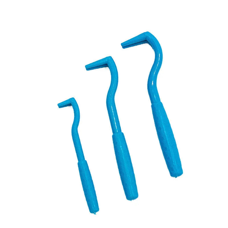Three plastic tick removal hooks for pets in blue or green colours with alcohol application instructions
