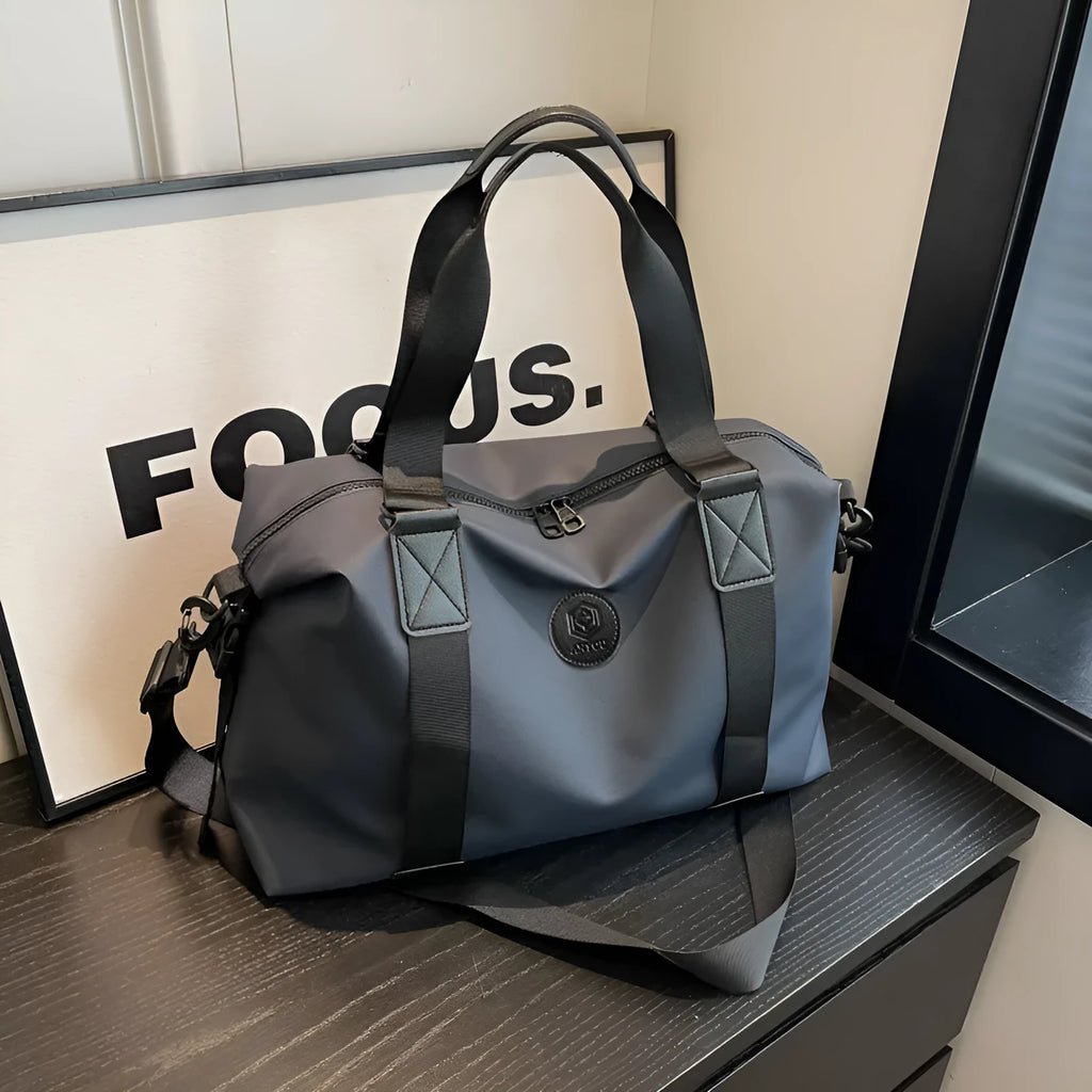 Waterproof Oxford cloth travel bag with 36-55 litre capacity in solid colour design