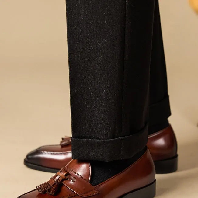 Men's black genuine leather tassel loafers with a rubber sole