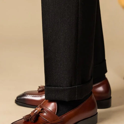 Men's black genuine leather tassel loafers with a rubber sole