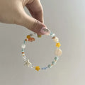 Orange mixed material women's bracelet with diamond shape and round seaside elements