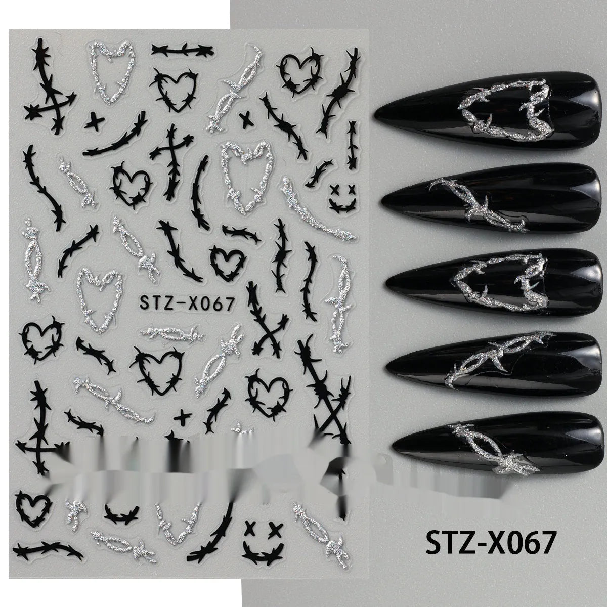 Sheet of black and silver love heart pattern nail art stickers with a plastic nail patch.