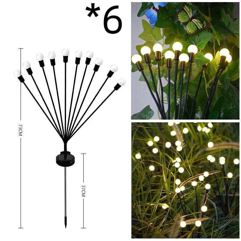 Solar-powered LED ground spike garden light with multiple heads and stainless steel soil plug.