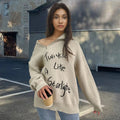 Women's light khaki Alpaca wool pullover sweater with a turtleneck, loose lapels, and a diagonal oblique zipper.