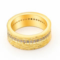 Gold coloured geometric zircon ring for women on a plain background, showing its structured shape.