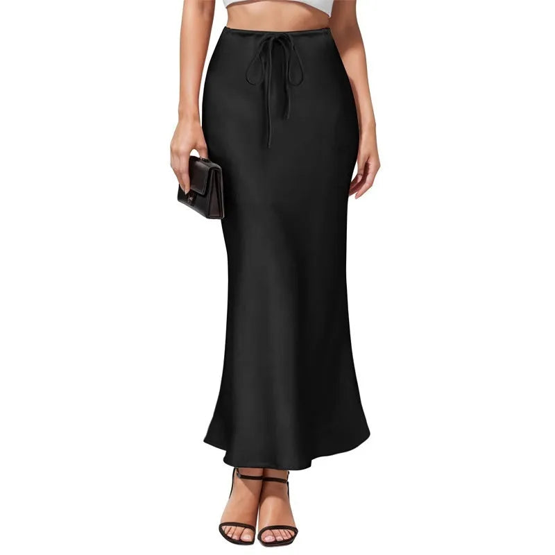 Asymmetric acetate satin skirt in milky white showing high waist design and irregular stitching detail