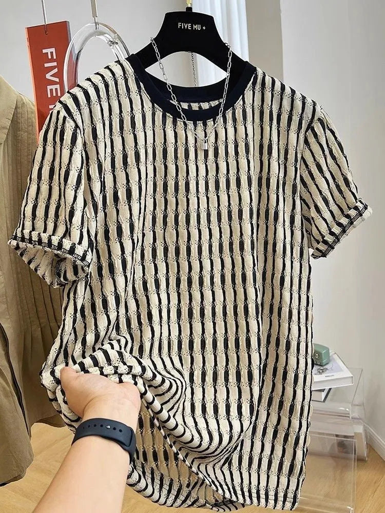Men's black and white striped short sleeve linen shirt with loose fit pullover style displayed on flat lay