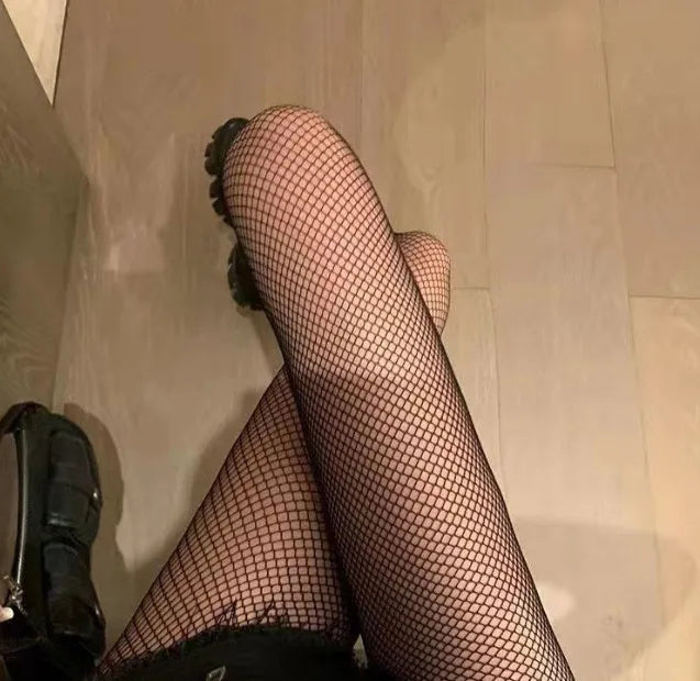 Women's black and white mesh pattern tights showing large, medium, and small net designs for summer.