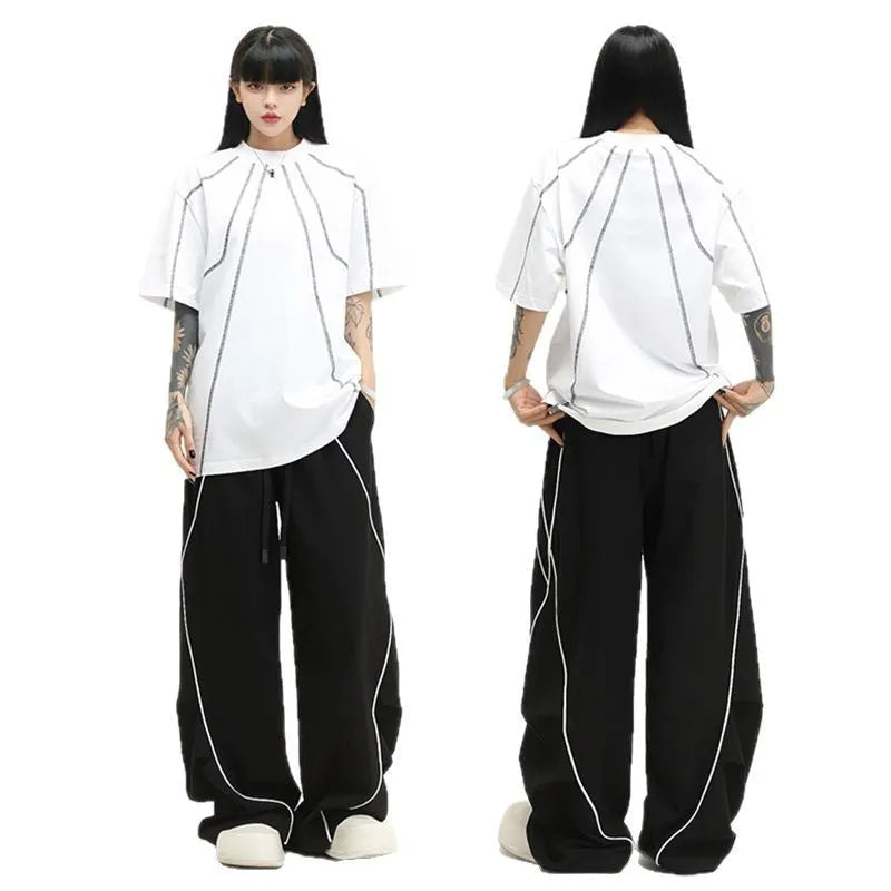 Black pleated wide-leg hip hop pants with striped pattern and mid waist, loose fit polyester streetwear trousers