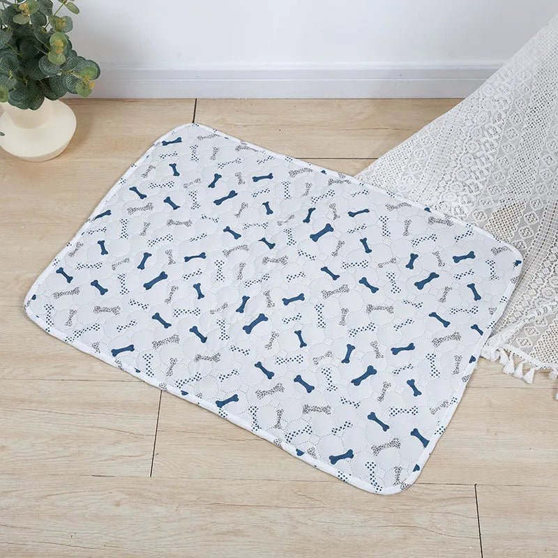 Reusable waterproof pet training pad showing colour pattern options and non-slip backing