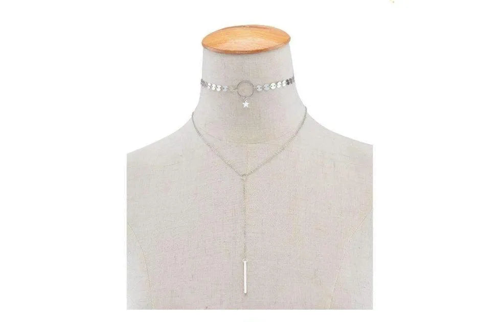 Star Goddess gold duo layering choker necklace on display