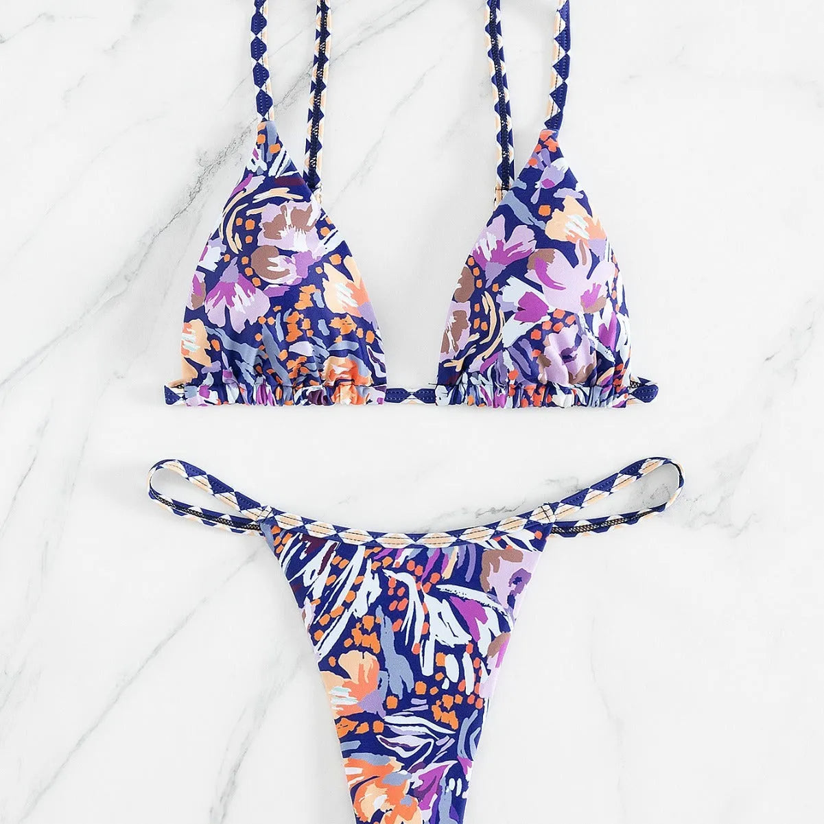 Women's floral printed polyester swimsuit with triangle bag design and briefs style bottom in S, M, L sizes
