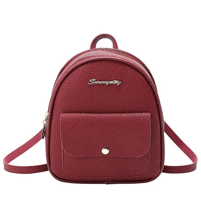 Compact black PU women's shoulder bag also worn as a small backpack, showing zipper closure.