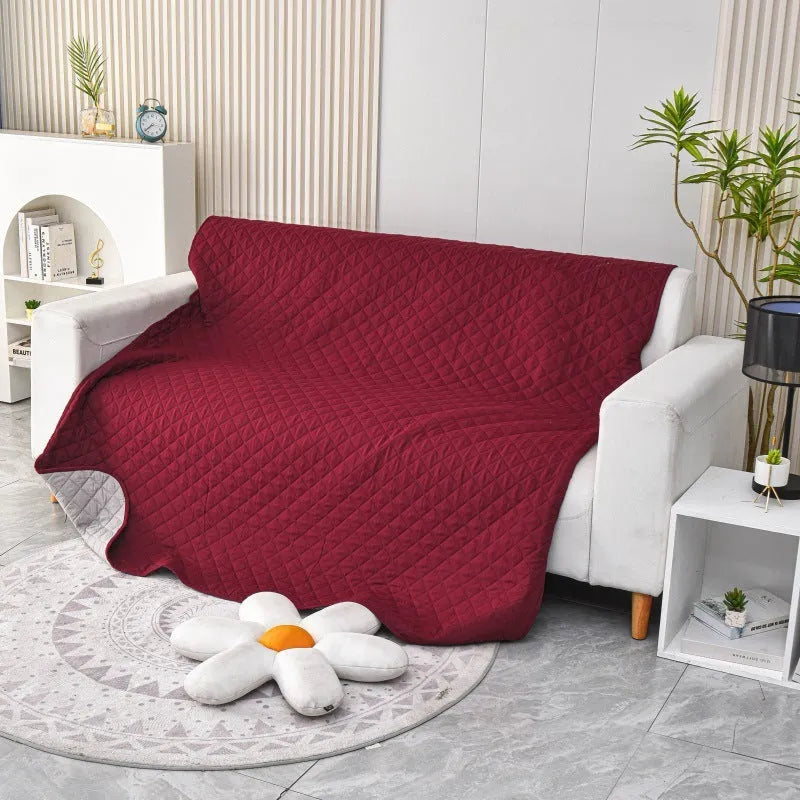 Reversible dog blanket sofa cover in burgundy colour protecting furniture