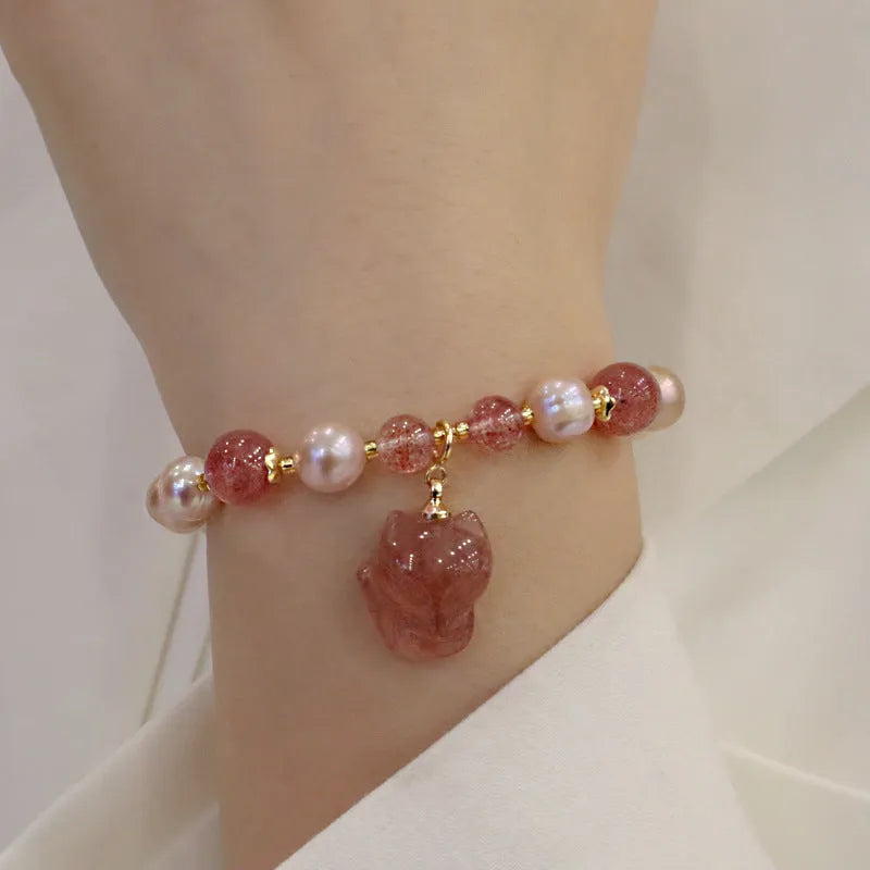 Women's natural freshwater pearl bracelet light pink colour with fox charm on wrist