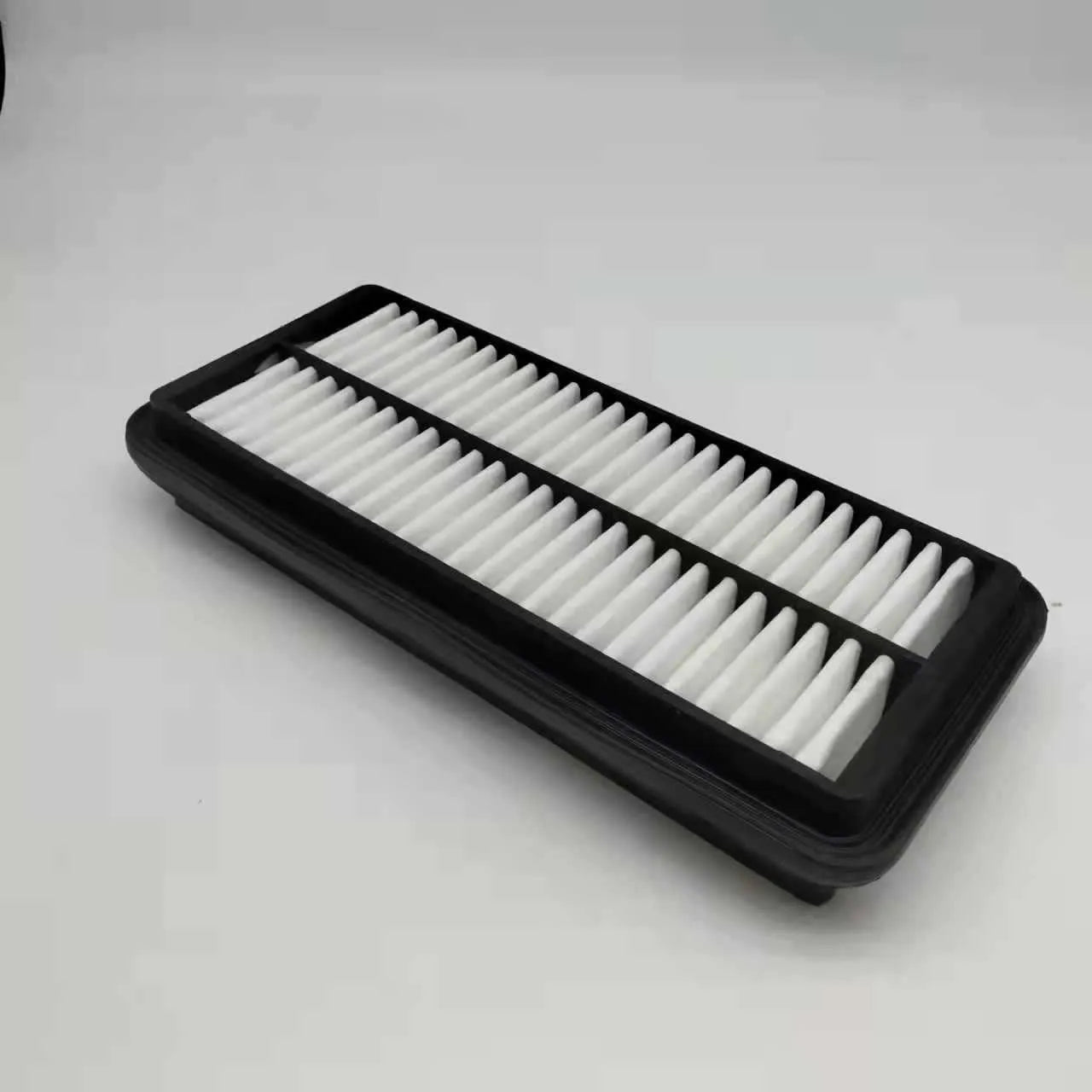 Black car air filter measuring 256x113x40mm for modern vehicle replacement
