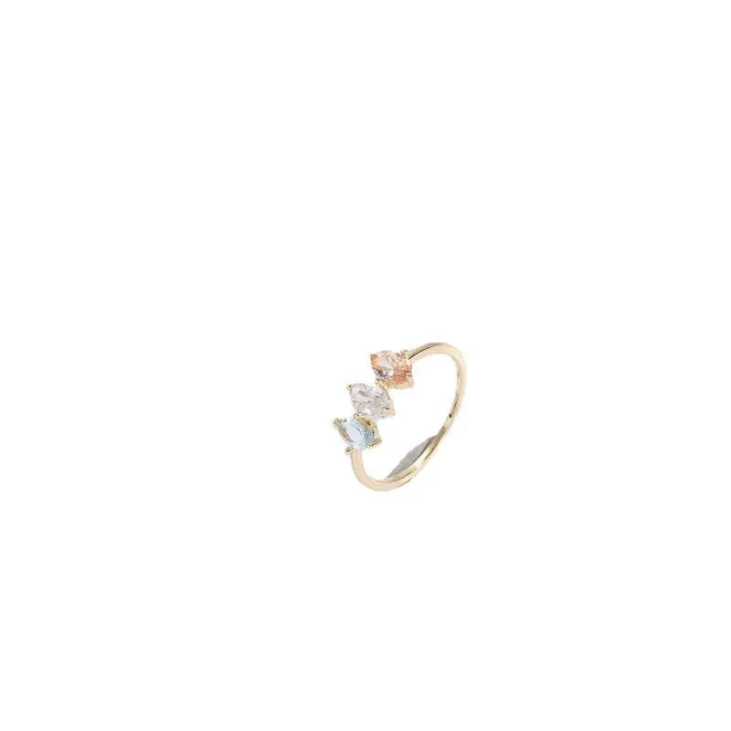 Geometric triangle women's ring with tricolor zircon horse eye design in electroplated gold.