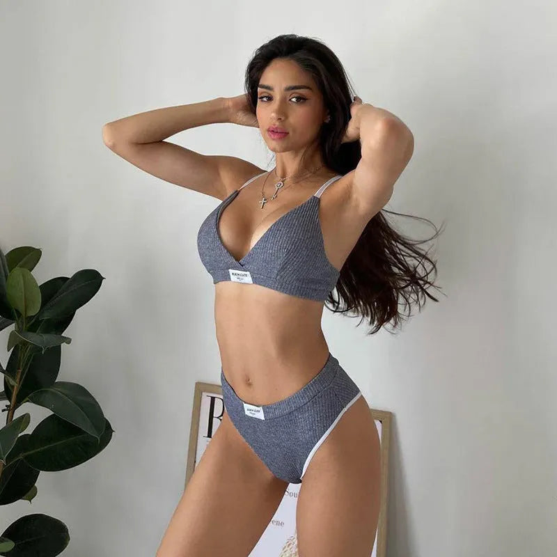 Women's grey polyester bikini set with embroidery and contrast colour binding on sleeveless top and shorts