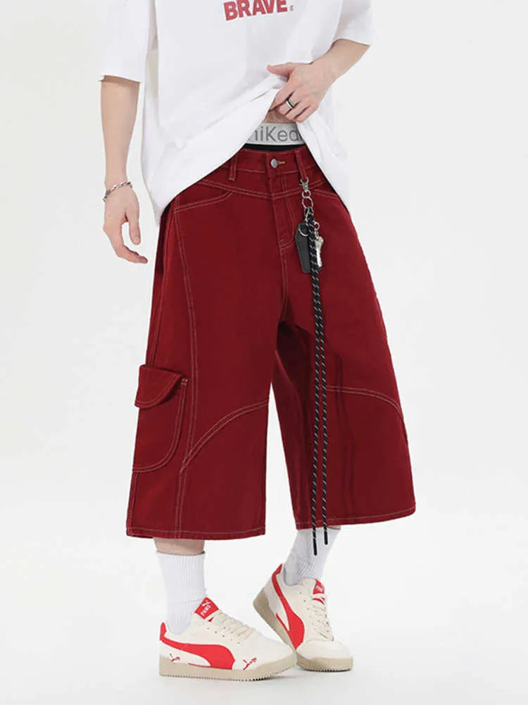 Retro denim multi-pocket workwear shorts in a wide leg cropped style, shown in red and black.