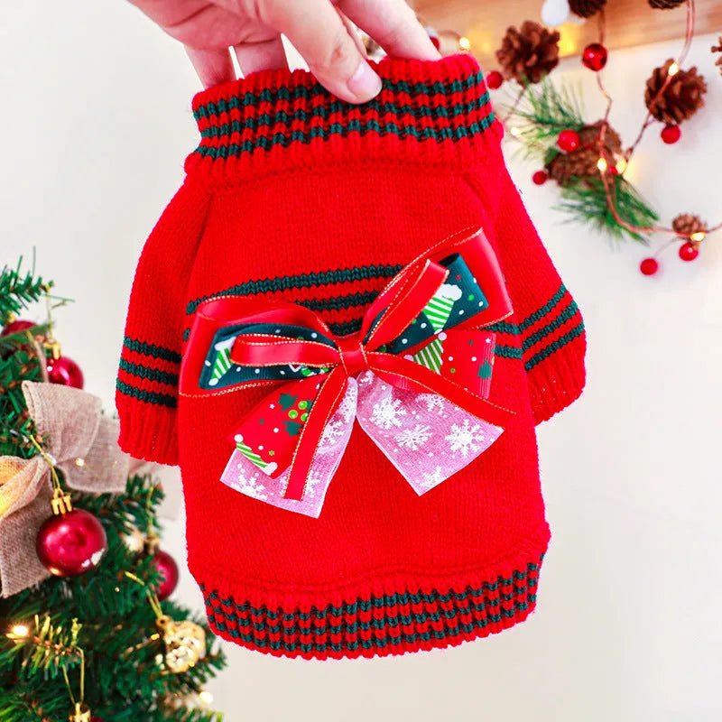 A red polyester Christmas jumper for a dog, shown on a mannequin, with sizes ranging from XS to XL.