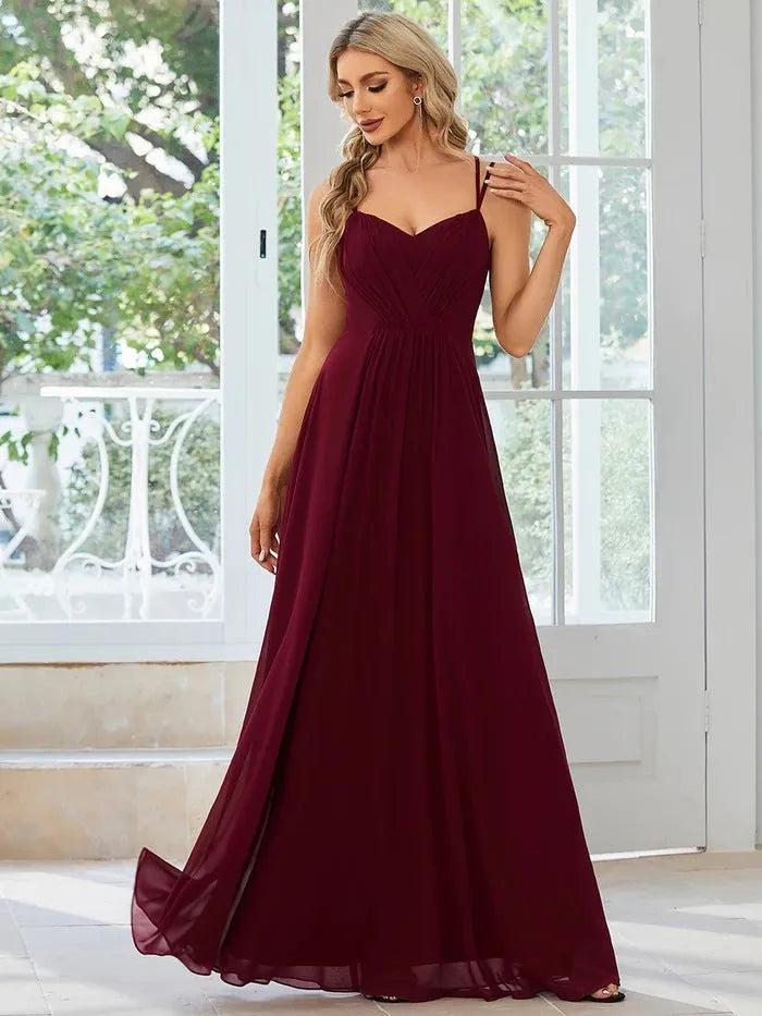 Women's sleeveless long A-line pleated dress in solid colour polyester fabric