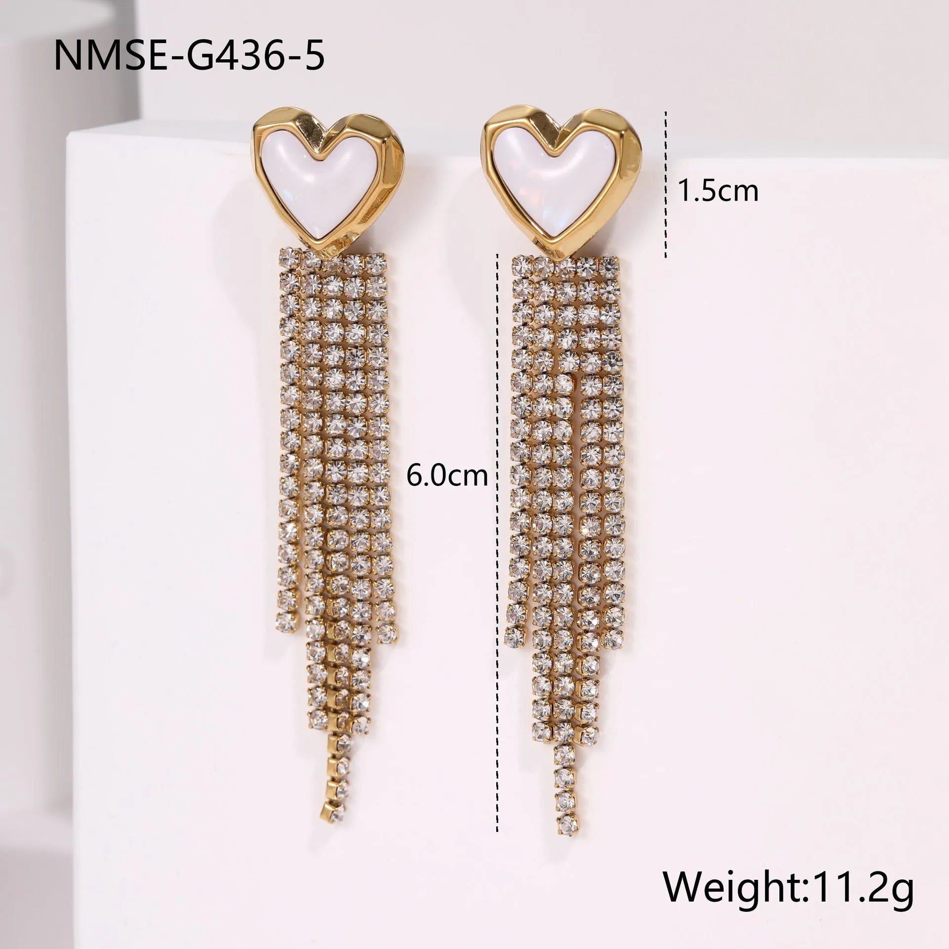 Gold electroplated stainless steel fashion earrings with heart, star, and geometric tassel design.