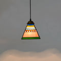 Small art stained glass droplight pendant with coloured shade hanging from ceiling.