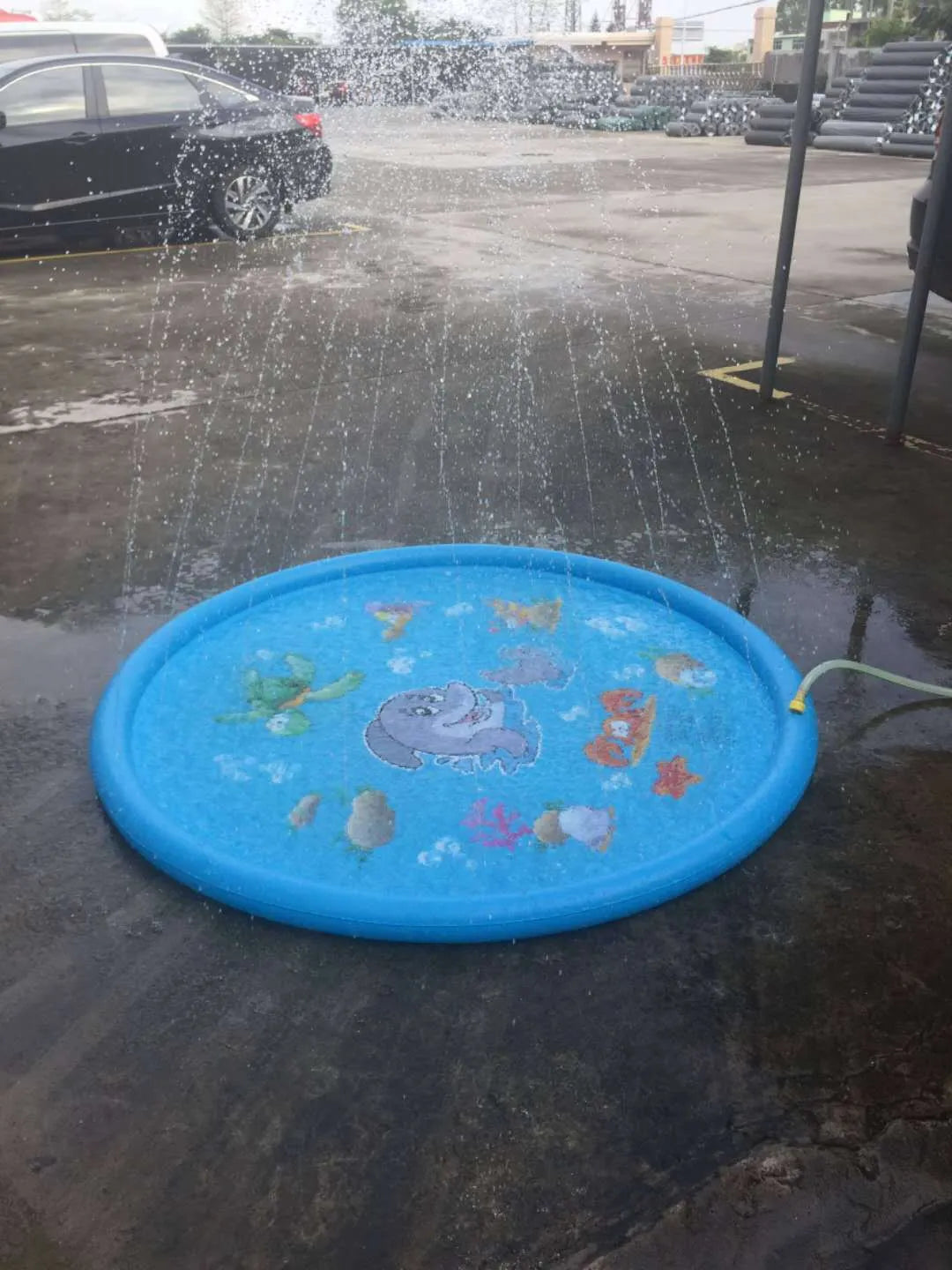 Blue PVC children's water spray mat with marine animal prints, measuring 100cm by 170cm