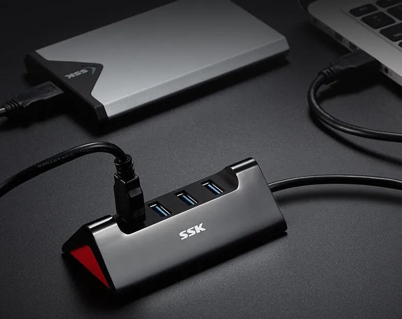 Black USB expansion dock with four ports and Micro USB connection in compact ABS housing