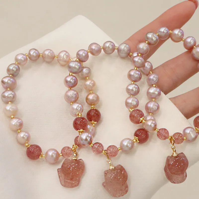Women's natural freshwater pearl bracelet light pink colour with fox charm on wrist