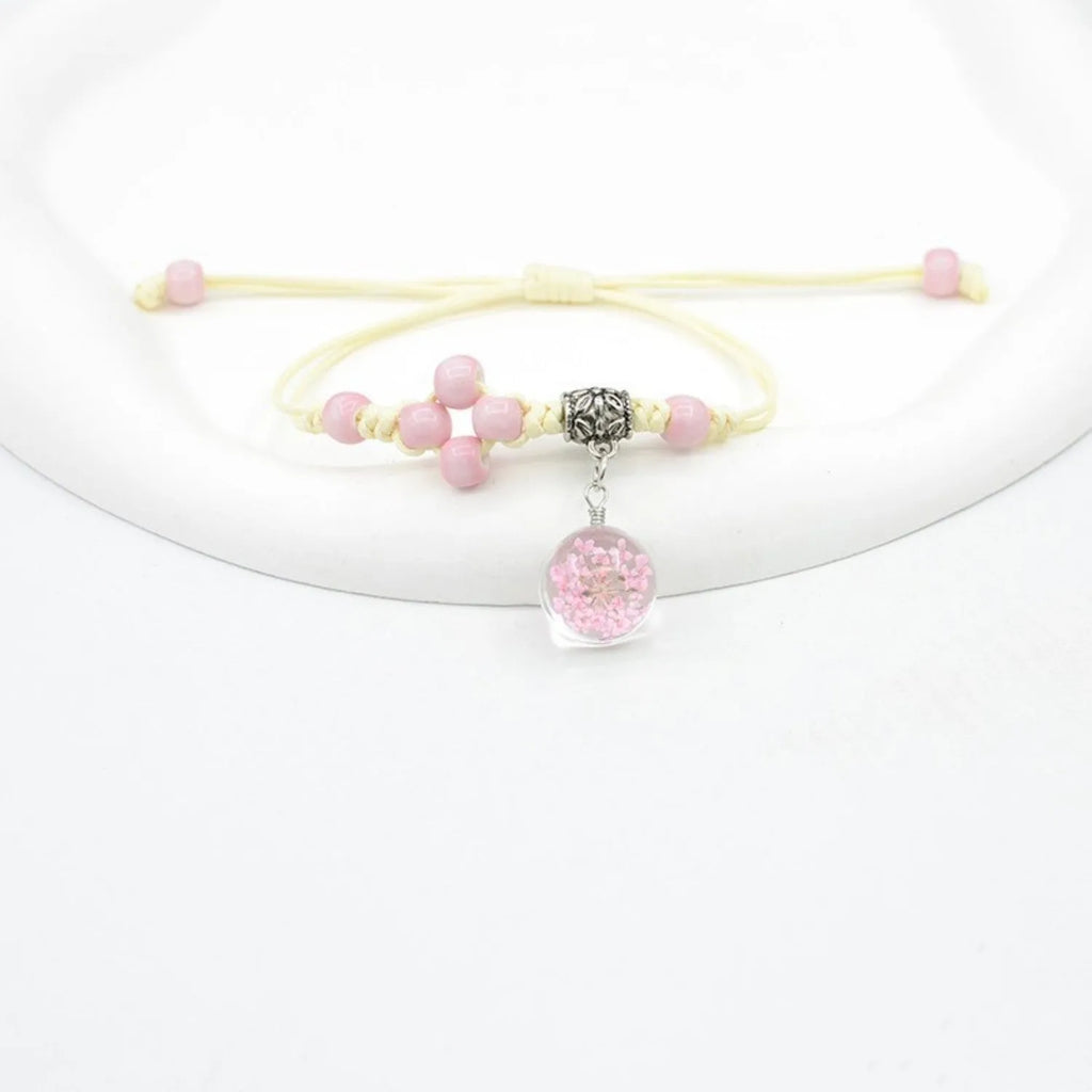 Glass dried flower bracelet with large 1.4cm beads containing real preserved flowers in hand-woven design